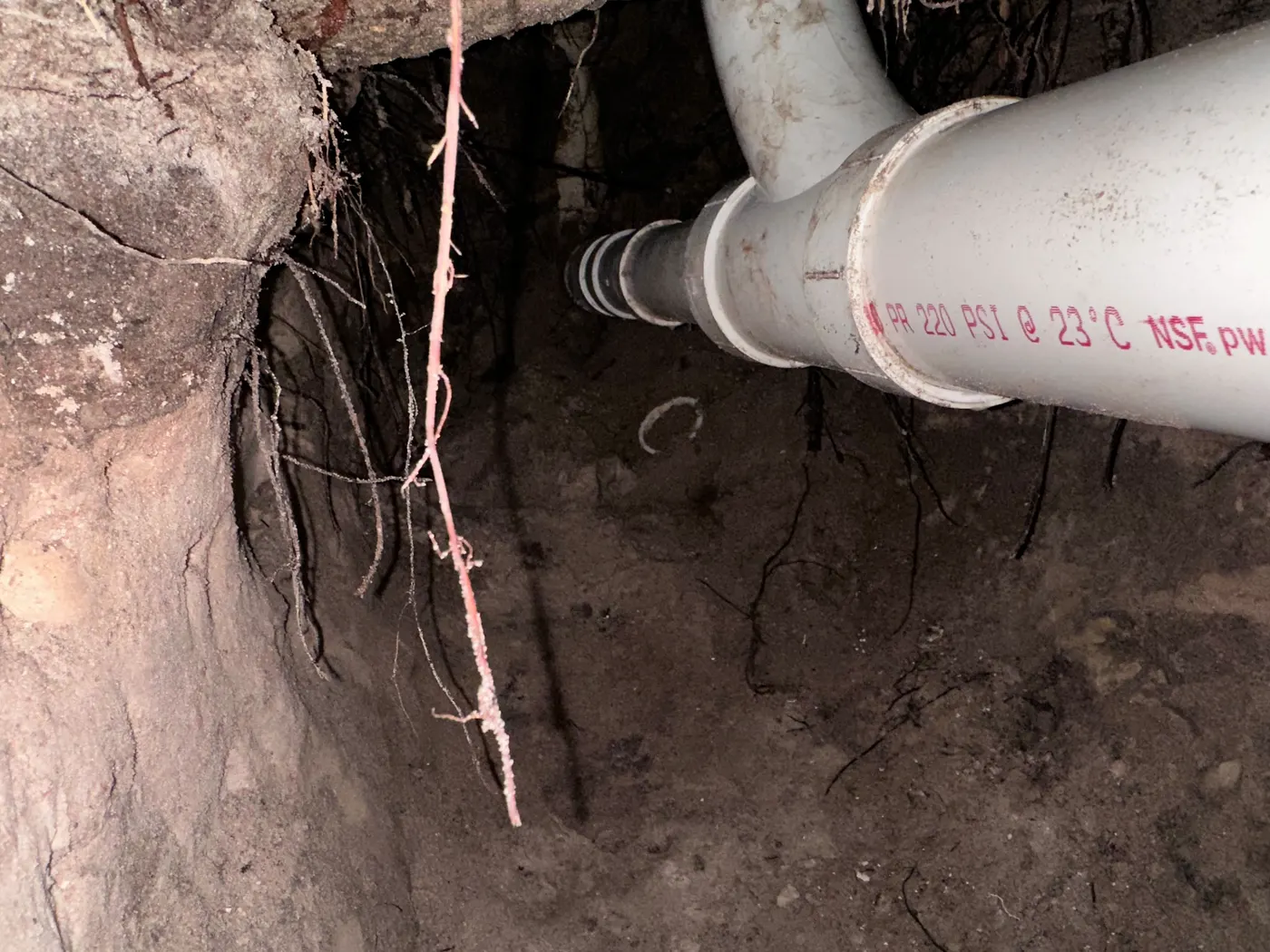 New PVC sewer line with cleanout, ready for backfill